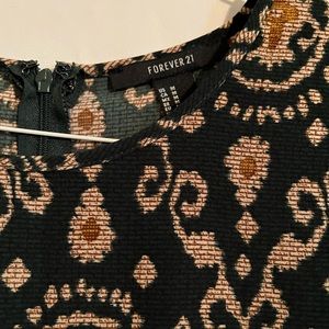 Dark green and gold rounded neck dress, length skirt